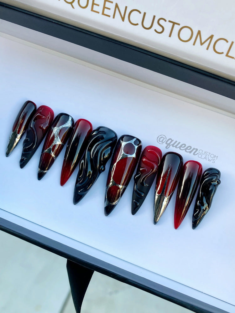 a group of different colored press on nails sitting on top of a table