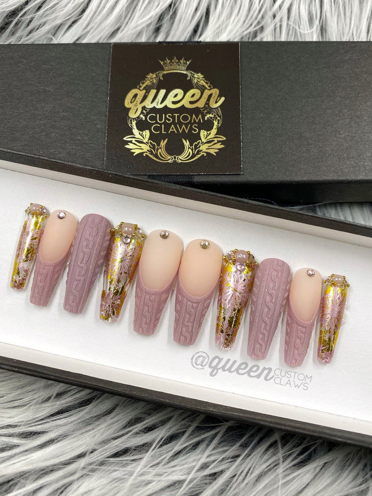 a box of pink and gold sweater texture press on nails